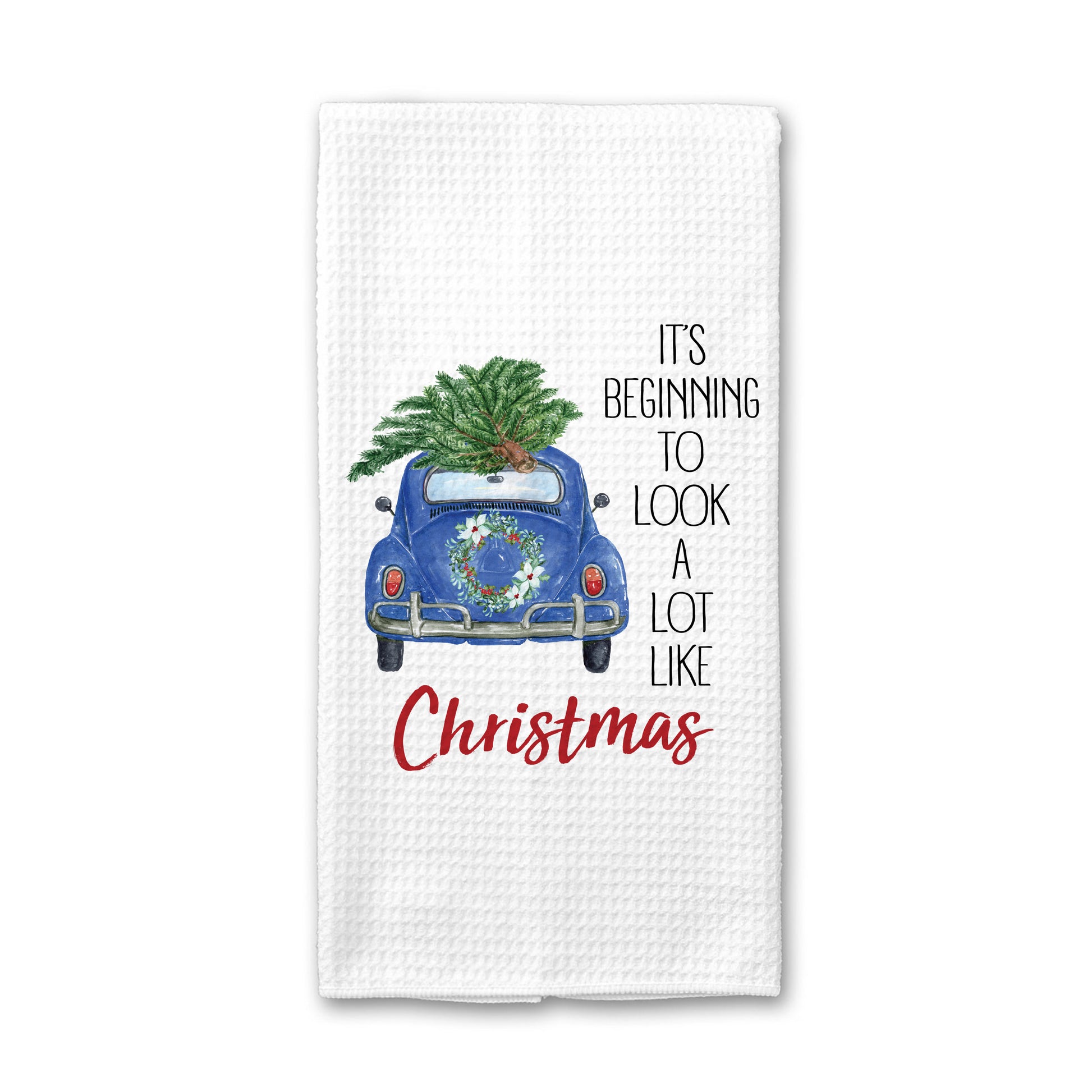 https://canaryroadwholesale.com/cdn/shop/products/TOWEL-LOOKXMASBLUETRUCK-NP-WB.jpg?v=1660314562&width=1946